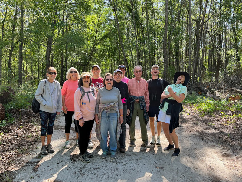 A group of hikers laughing and enjoying the outdoors.